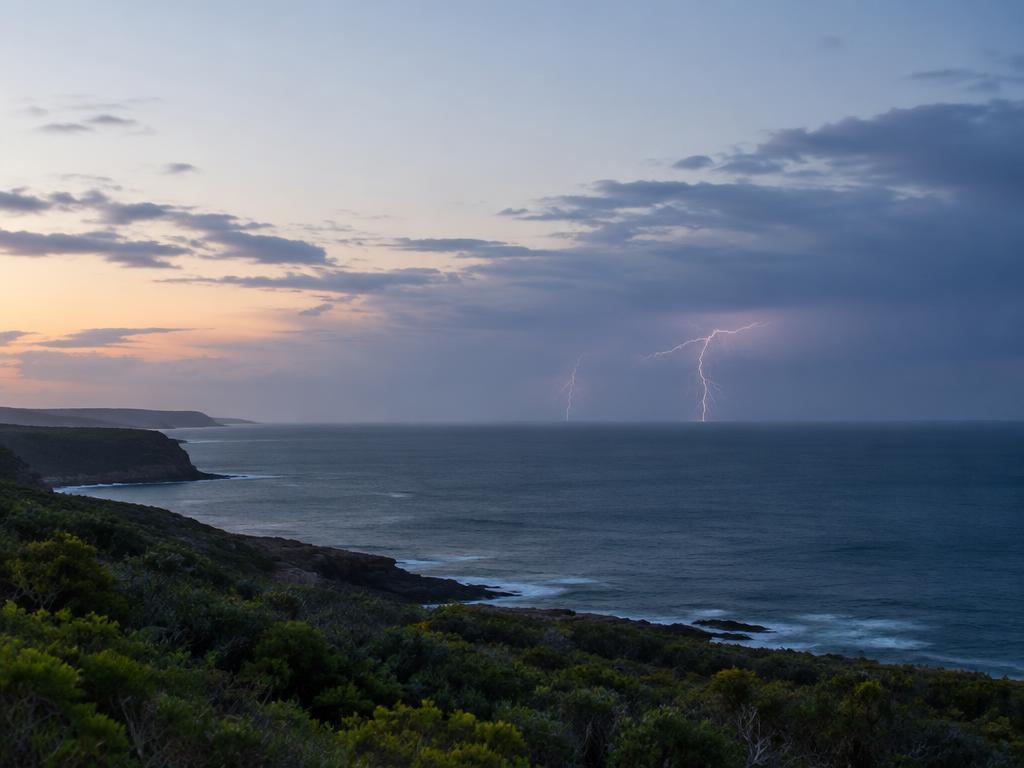 Distant lightning over the ocean illustrating atmospheric electricity